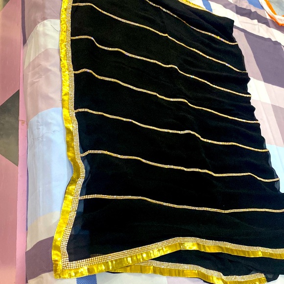 Sleek chic party wear black saree with golden lace on all sides - Picture 4 of 8